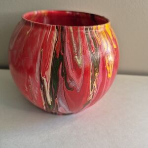 Vibrant Red and Yellow Rose Arrangement in Artistic Round Vase Hand Poured